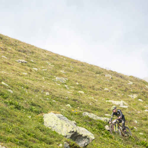 A large,steep hill with bikers traversing the side of it [Epic Series]