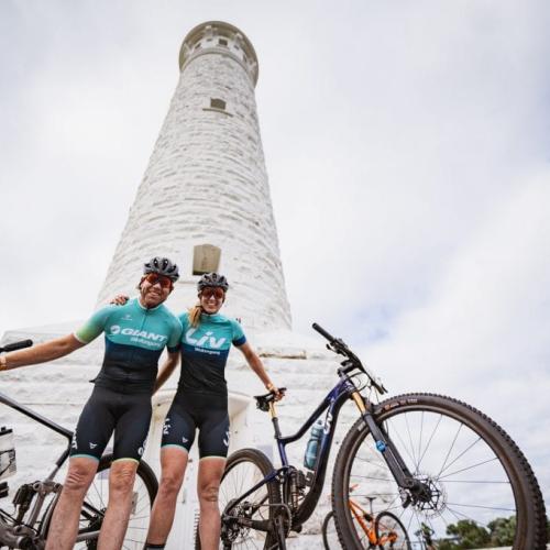Two bikers posing in front of Cape Leeuwin lighthouse [Cape to Cape]