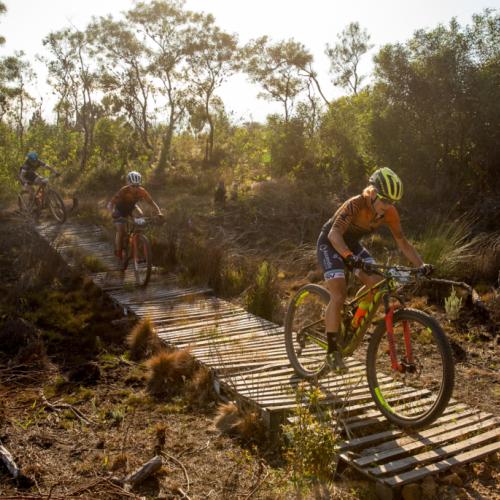 Groot and McDougall crossing a wooden bridge [FNB Wines2Whales]