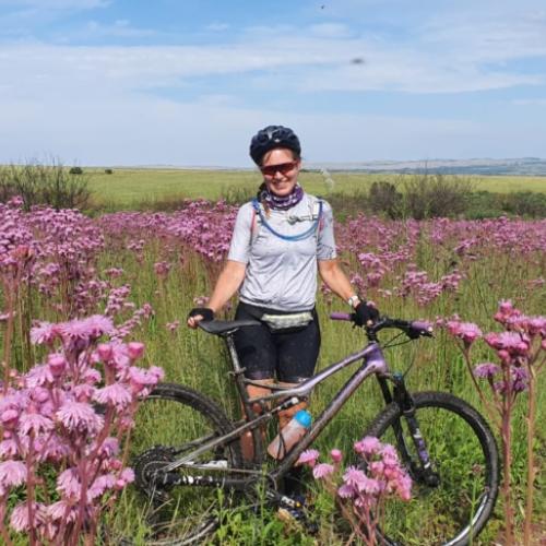 Rowena in a field of flowers [FNB Wines2Whales]