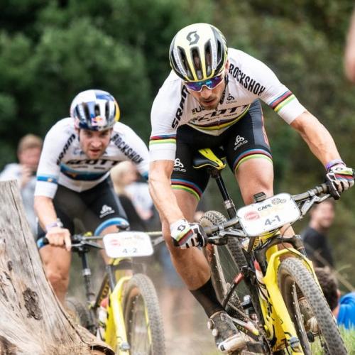 Schurter and Forster racing past a stump [Absa Cape Epic]