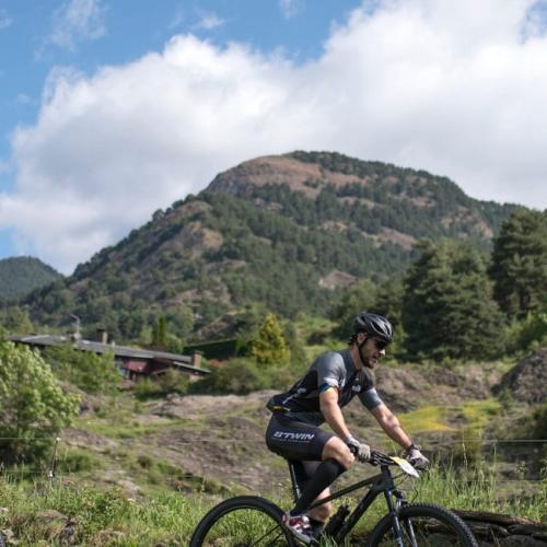 A shot of two bikers with an Andorran background [Andorra MTB Classic-Pyrenees]