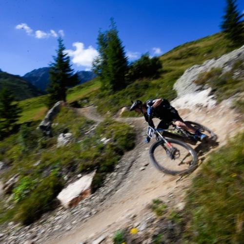 e-bikes on the Swiss Epic Team taking a steep bank [Swiss Epic]