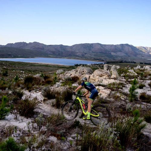 Singular biker on a rocky landscape [FNB Wines2Whales]