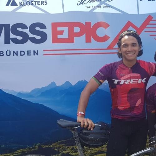 Two bikers posing in front of the Swiss Epic poster [Swiss Epic]