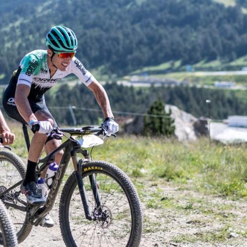 Two bikers heading across a Pyrenees landscape [Andorra MTB Classic-Pyrenees]